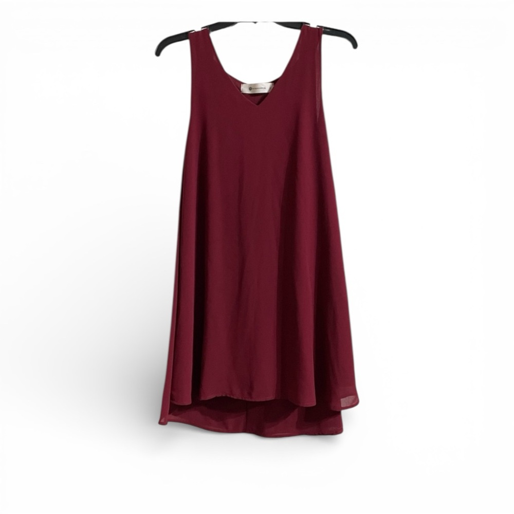 Burgundy dress with attached‎ cape.